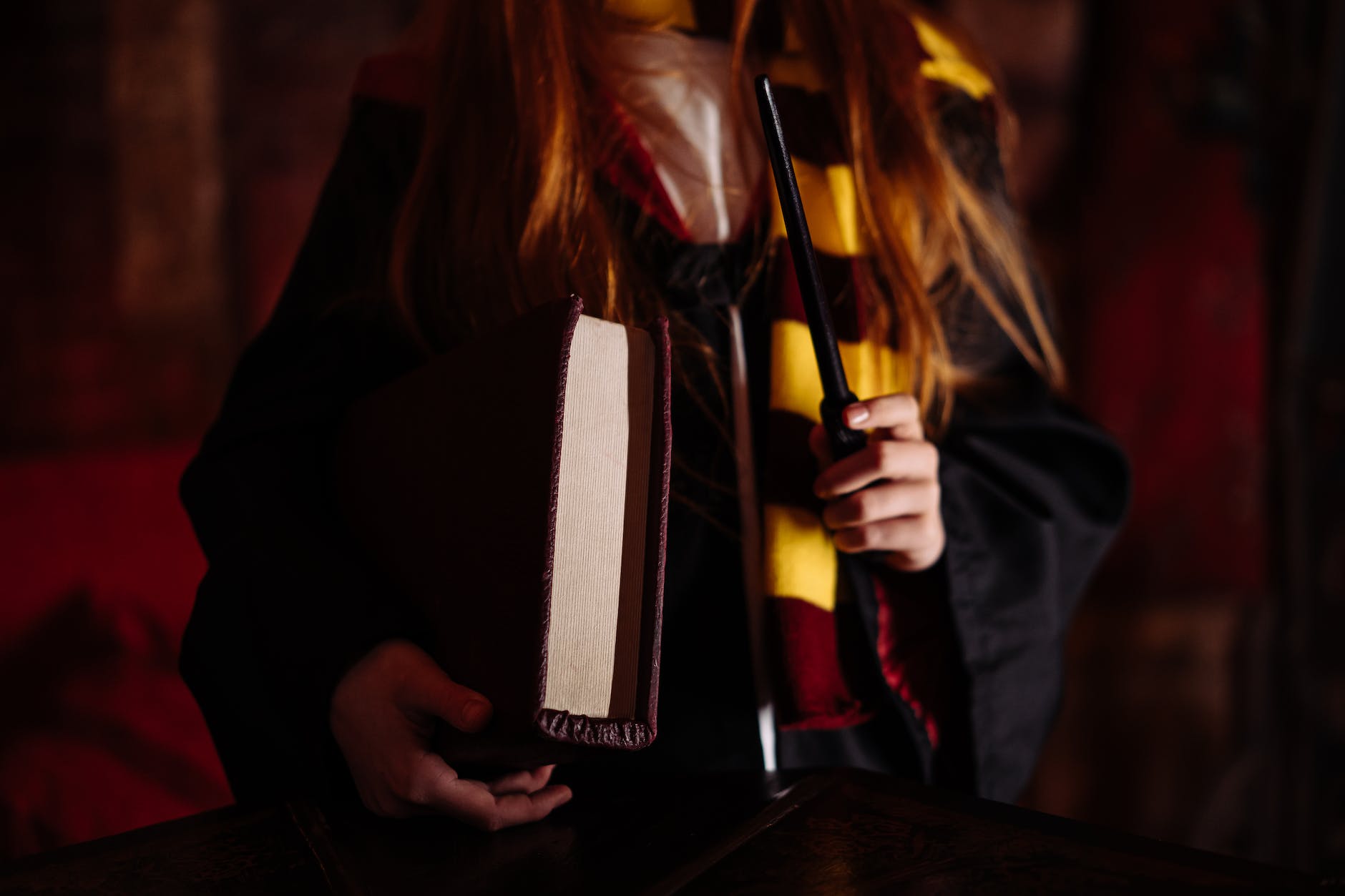 a close up shot of a girl holding a wand